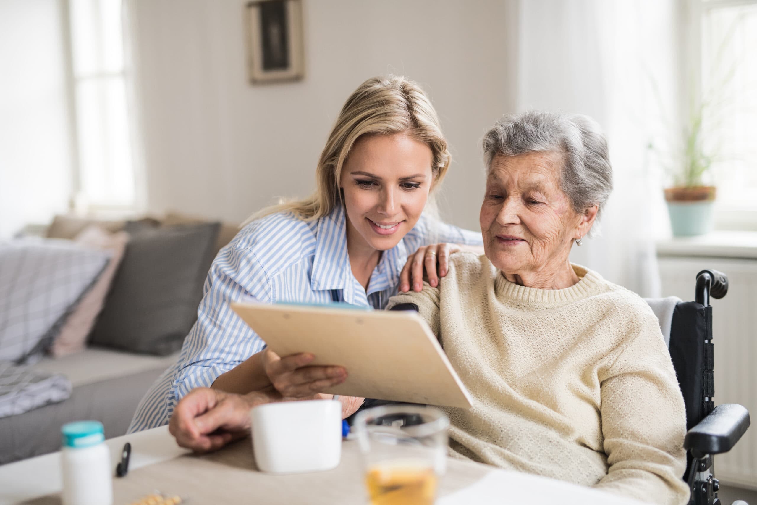 A health visitor measuring a blood pressure of a senior woman at home. Important Questions To Ask When Choosing A Home Care Agency