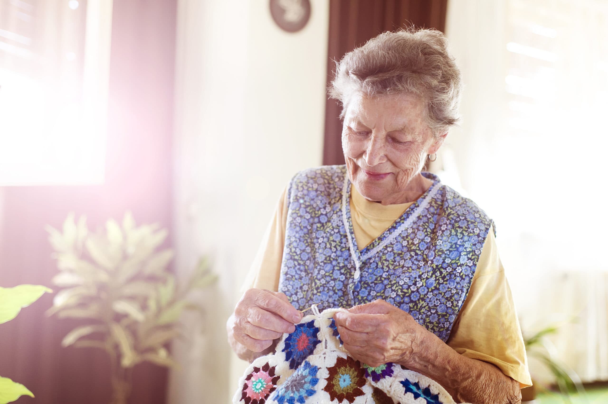 Old woman knitting Improving Quality Of Life For The Elderly