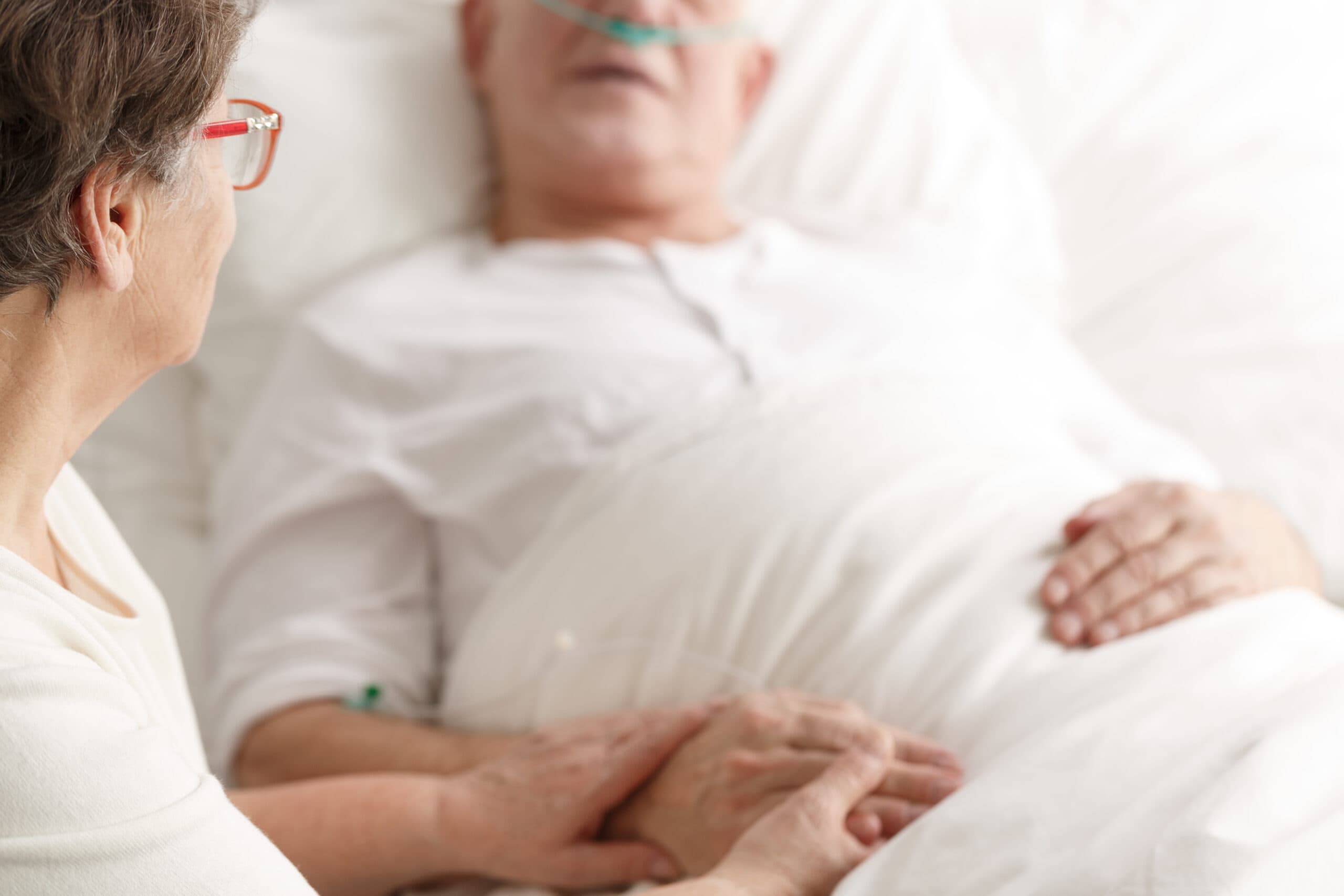Wife caring about dying spouse Choosing the Right End of Life Care Option for a Loved One
